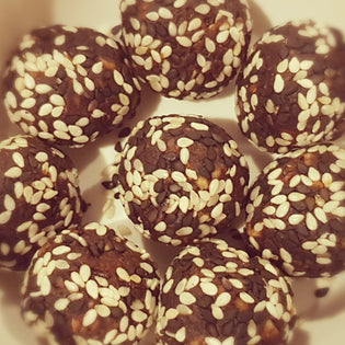  Chocolate Date Balls Covered in Sesame Seeds - RunFaster